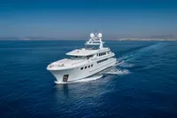Luxurious 2004 R.B Dereli yacht cruising on open blue sea under clear sky.