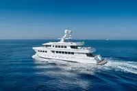 Luxurious R.B Dereli 2004 yacht cruising on open blue sea under clear sky.