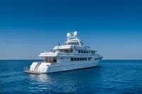 Luxurious R.B Dereli 2004 yacht cruising on calm blue ocean under clear sky.