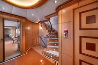 Luxurious yacht interior with elegant wooden staircase and modern design, R.B Dereli 2004 model.