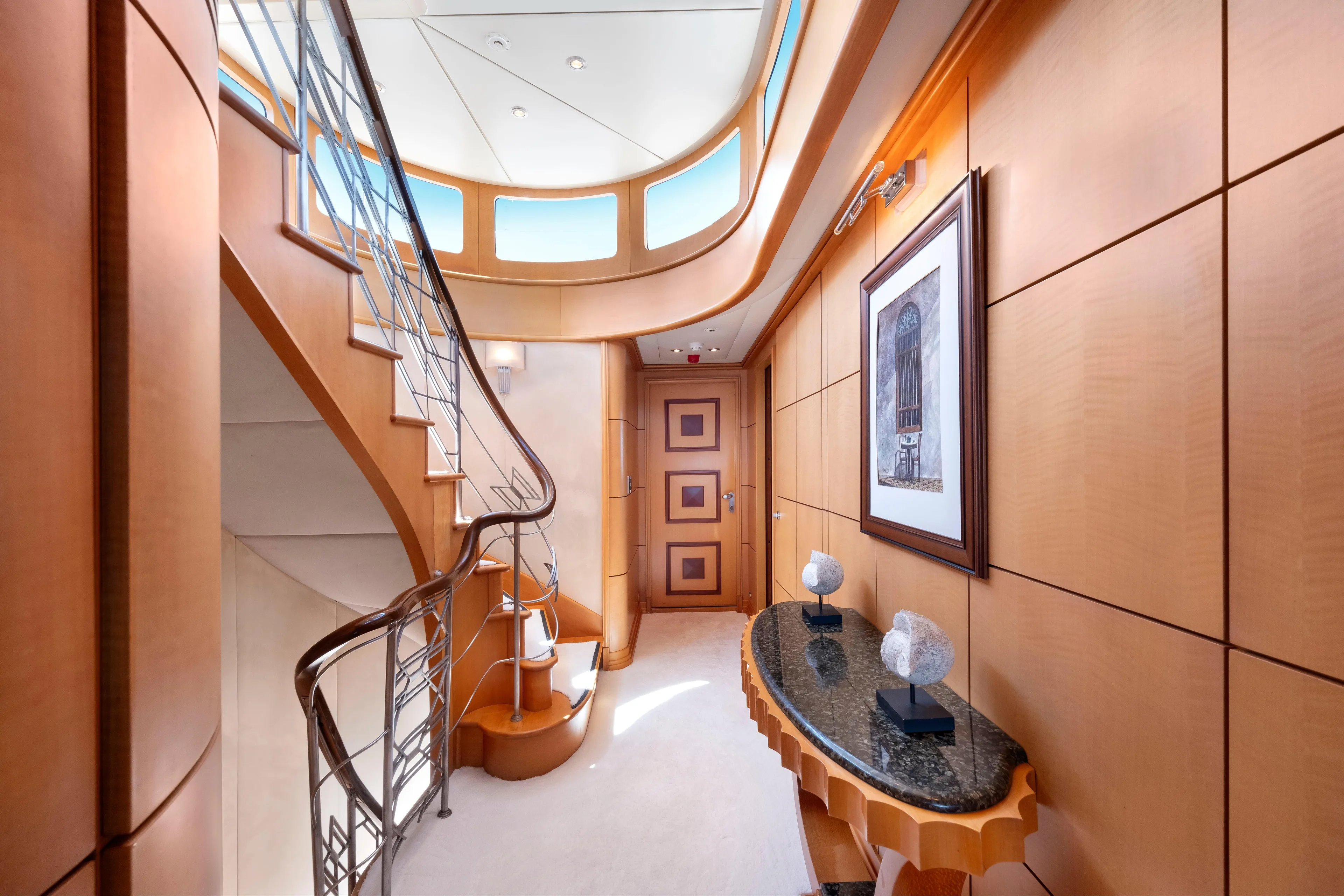 Luxurious yacht interior with elegant staircase and modern decor, R.B Dereli 2004 model.