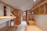 Luxurious cabin interior of 2004 R.B Dereli yacht with wooden furnishings and bunk beds.