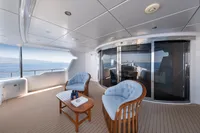 Luxurious yacht deck with seating, ocean view; R.B Dereli 2004 model.