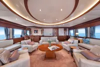 Luxurious yacht interior with elegant seating, wooden accents, and ocean views, R.B Dereli 2004 model.
