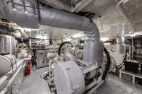 Engine room of 2004 R.B Dereli model, featuring complex machinery and insulated pipes.