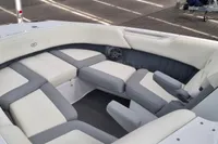 2016 Cobalt 24 boat interior with white and gray seating, spacious and luxurious design.