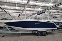 2016 Cobalt 24 boat on trailer in indoor storage facility.