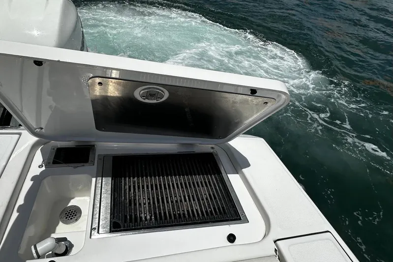  Yacht Photos Pics 2022 Bertram 39 CC boat with open grill and ocean view.