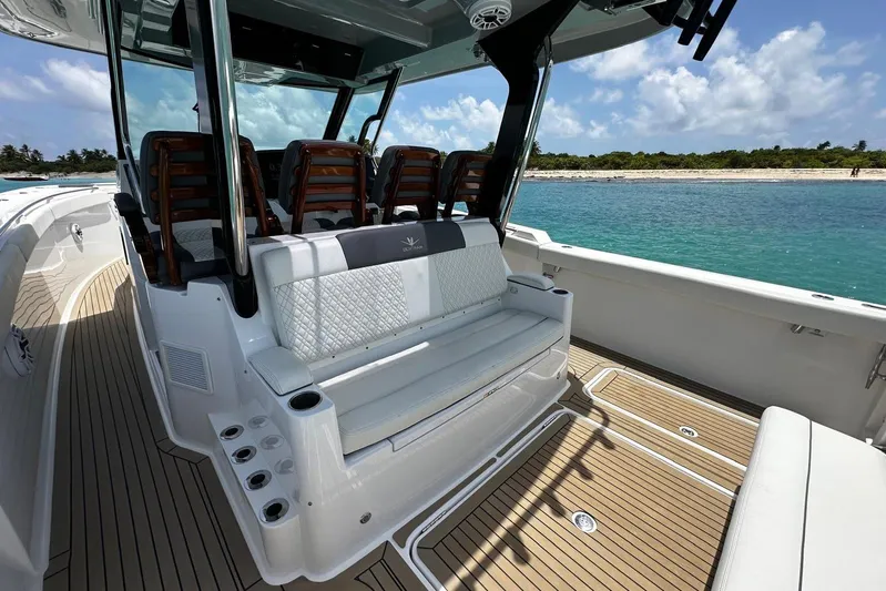  Yacht Photos Pics 2022 Bertram 39 CC boat interior with seating, ocean view, and teak flooring.