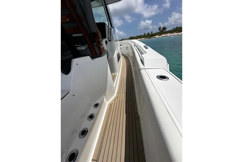  Yacht Photos Pics 2022 Bertram 39 CC boat deck with ocean view and clear sky.