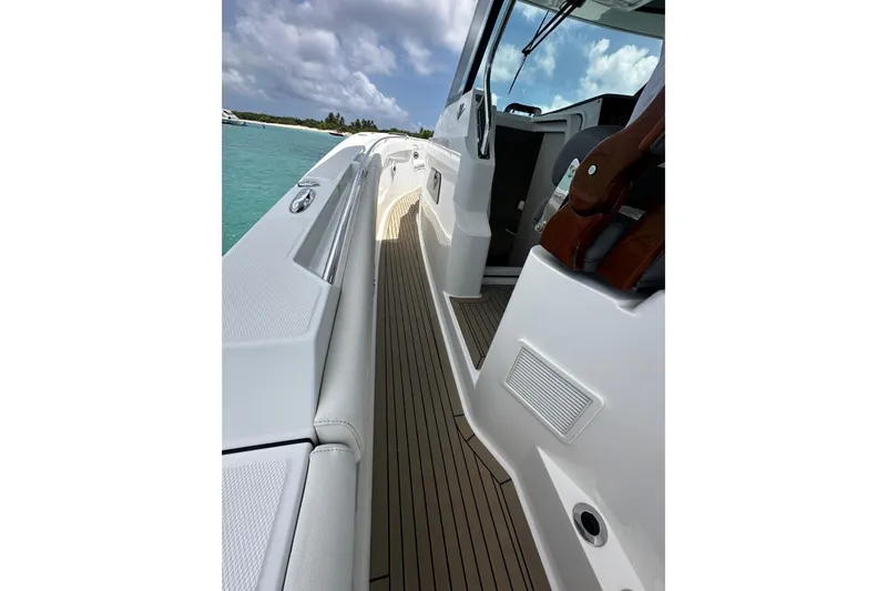  Yacht Photos Pics 2022 Bertram 39 CC boat deck with sleek design and ocean view.