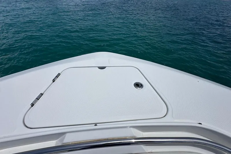  Yacht Photos Pics Bow of 2022 Bertram 39 CC boat on calm blue water.
