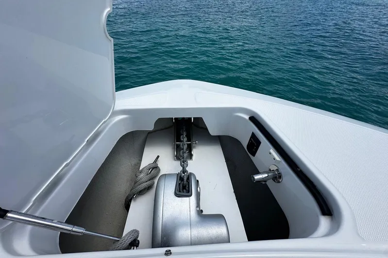  Yacht Photos Pics Anchor compartment of 2022 Bertram 39 CC boat, open hatch, ocean background.