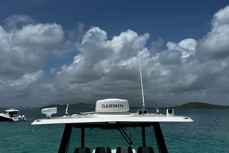  Yacht Photos Pics Bertram 39 CC boat with Garmin equipment on a cloudy day at sea, 2022 model.