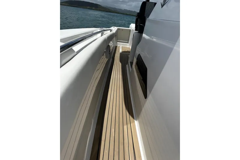  Yacht Photos Pics 2022 Bertram 39 CC boat deck with sleek design and wooden flooring.