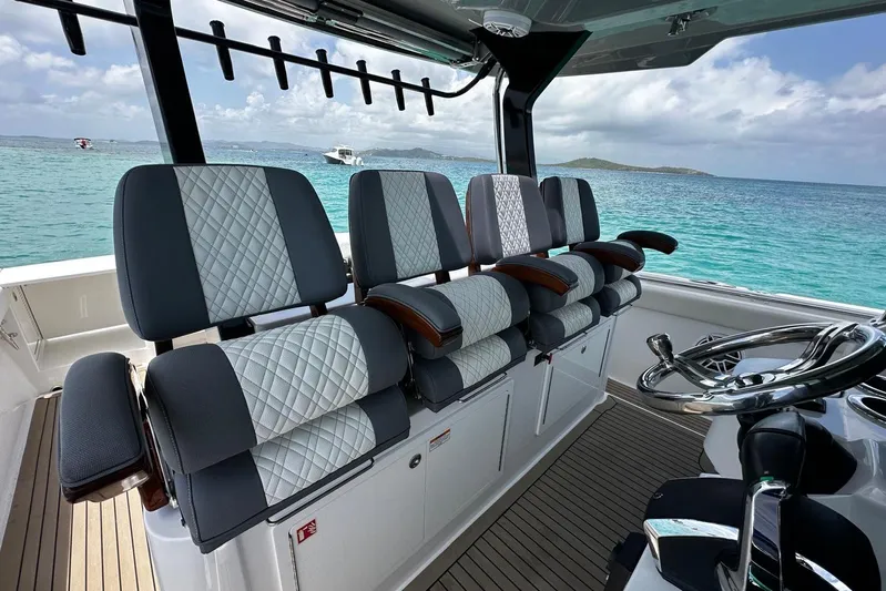  Yacht Photos Pics Interior of 2022 Bertram 39 CC boat with luxurious seating and ocean view.