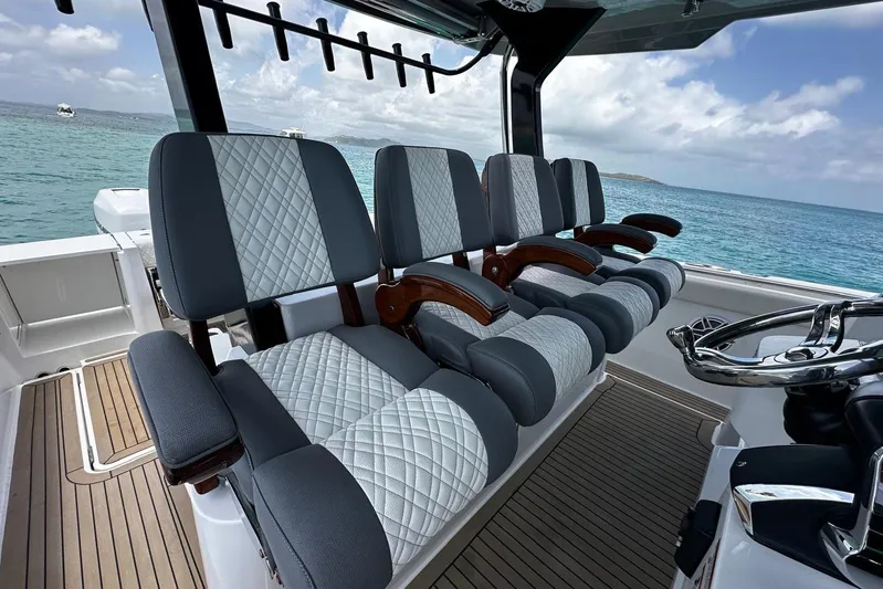  Yacht Photos Pics Luxurious seating on 2022 Bertram 39 CC boat with ocean view.