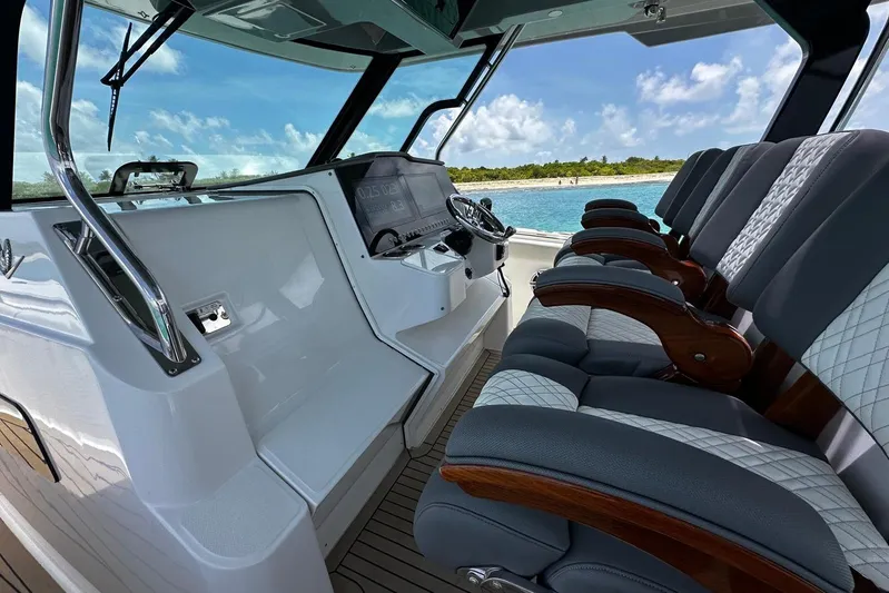  Yacht Photos Pics Interior of 2022 Bertram 39 CC boat with luxurious seating and modern dashboard.