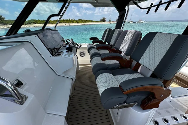  Yacht Photos Pics Interior of 2022 Bertram 39 CC boat with luxurious seating and ocean view.