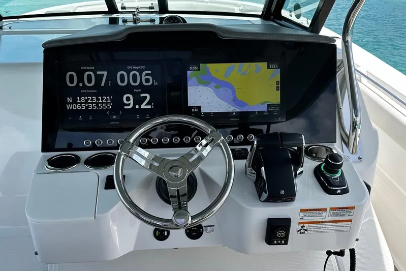  Yacht Photos Pics 2022 Bertram 39 CC helm with GPS navigation and control systems.