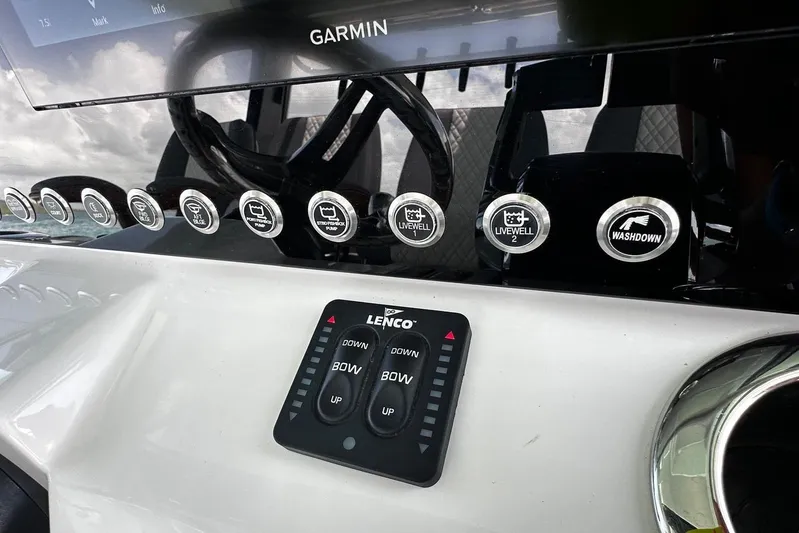  Yacht Photos Pics Control panel of 2022 Bertram 39 CC boat with Garmin display and Lenco controls.