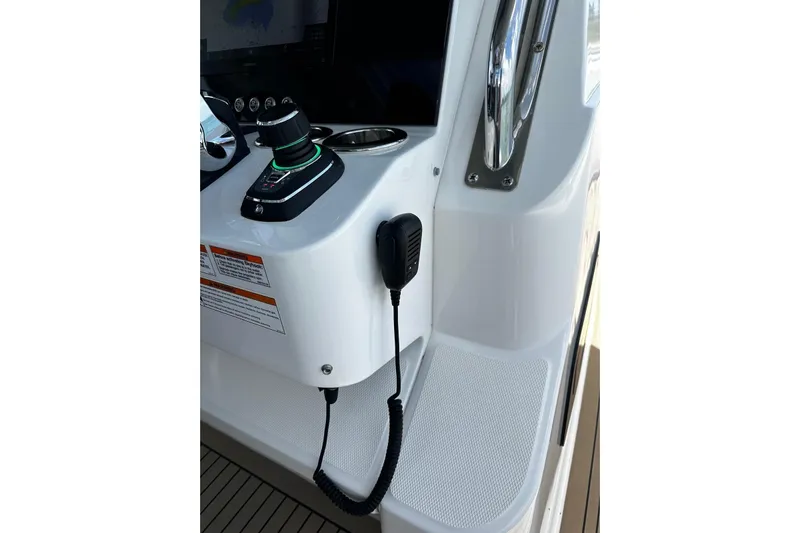  Yacht Photos Pics Control panel of 2022 Bertram 39 CC boat with joystick and microphone.