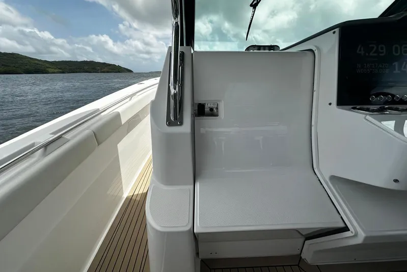  Yacht Photos Pics 2022 Bertram 39 CC boat interior with sleek design and modern dashboard.