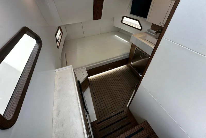  Yacht Photos Pics Interior of 2022 Bertram 39 CC boat with modern design and wood accents.