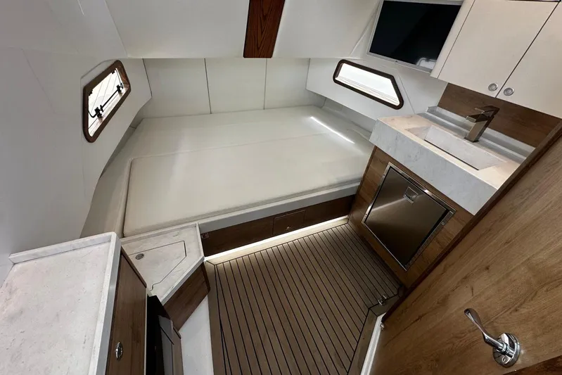  Yacht Photos Pics Luxurious interior of 2022 Bertram 39 CC boat with modern amenities and sleek design.