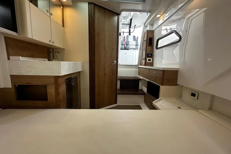 Yacht Photos Pics Interior of 2022 Bertram 39 CC boat, featuring modern cabinetry and sleek design elements.