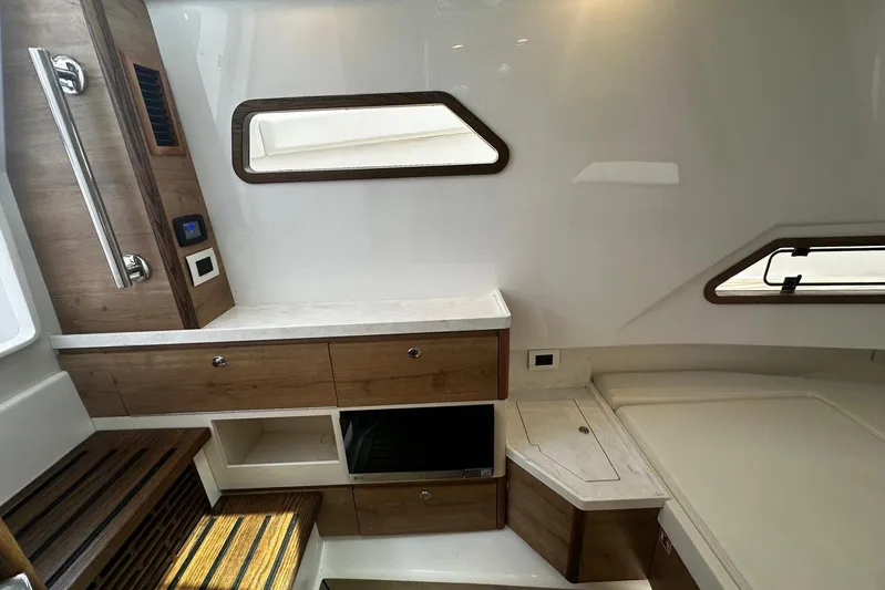  Yacht Photos Pics Interior of 2022 Bertram 39 CC boat featuring modern wood cabinetry and sleek design.