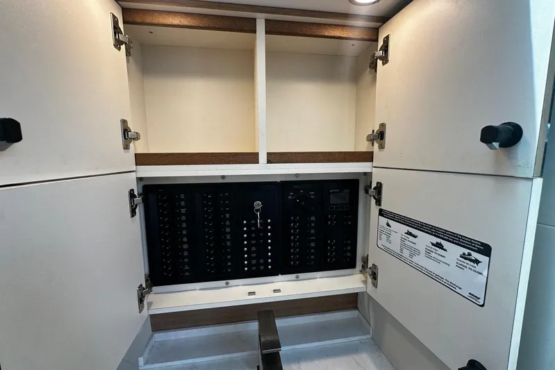  Yacht Photos Pics Electrical panel inside a 2022 Bertram 39 CC boat cabinet.