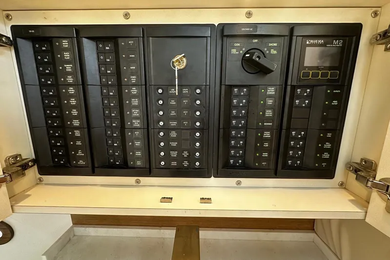  Yacht Photos Pics Electrical control panel on a 2022 Bertram 39 CC boat, featuring switches and indicators.