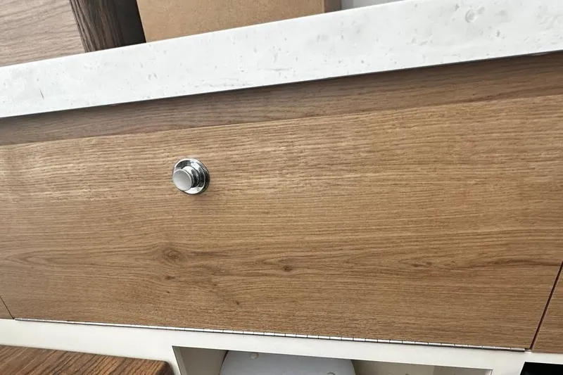  Yacht Photos Pics Wooden cabinet with chrome knob on Bertram 39 CC, 2022 model.