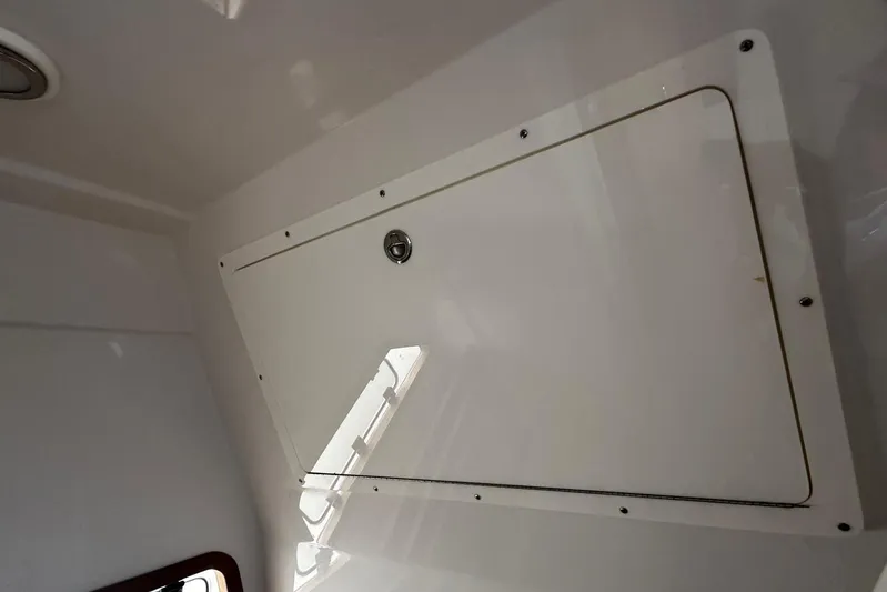  Yacht Photos Pics Interior hatch of 2022 Bertram 39 CC boat, featuring sleek design and secure latch.