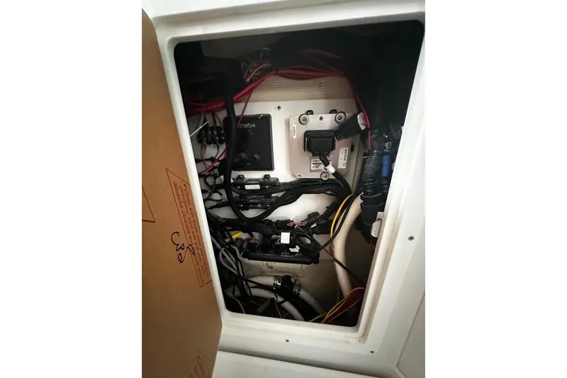  Yacht Photos Pics Electrical compartment of 2022 Bertram 39 CC boat with wiring and components.