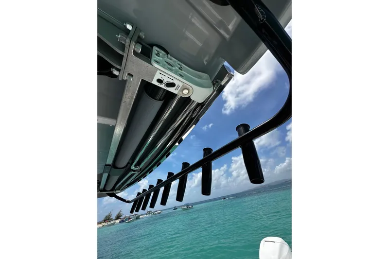  Yacht Photos Pics 2022 Bertram 39 CC boat with rod holders, ocean view, and clear sky.