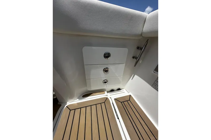  Yacht Photos Pics 2022 Bertram 39 CC boat interior with sleek storage drawers and wooden flooring.