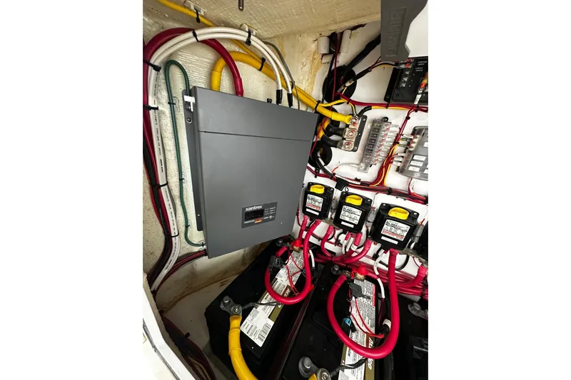  Yacht Photos Pics Electrical system of a 2022 Bertram 39 CC boat, featuring wiring and battery setup.