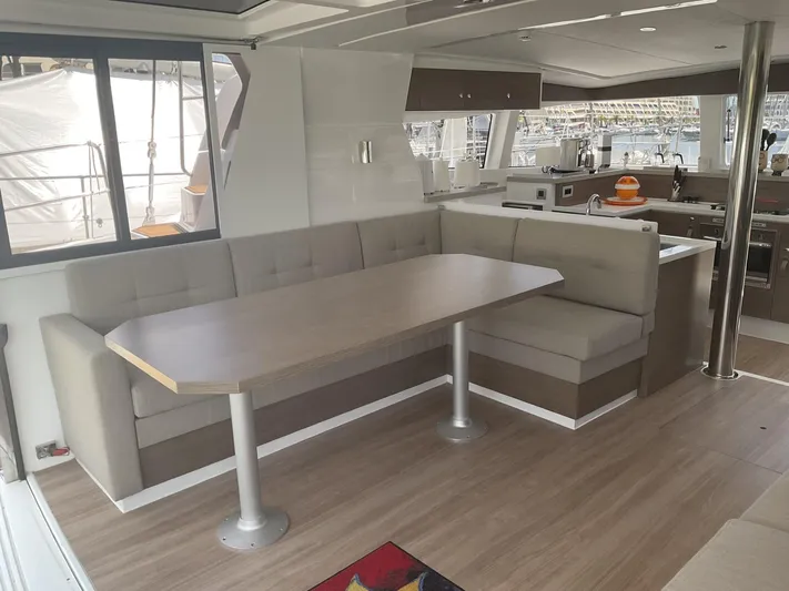 Yacht Photos Pics Modern interior of 2023 Bali 4.2 yacht with dining area and kitchen.