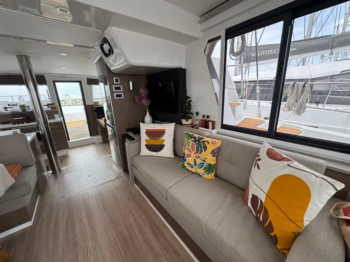  Yacht Photos Pics Modern interior of 2023 Bali 4.2 yacht with stylish cushions and large windows.