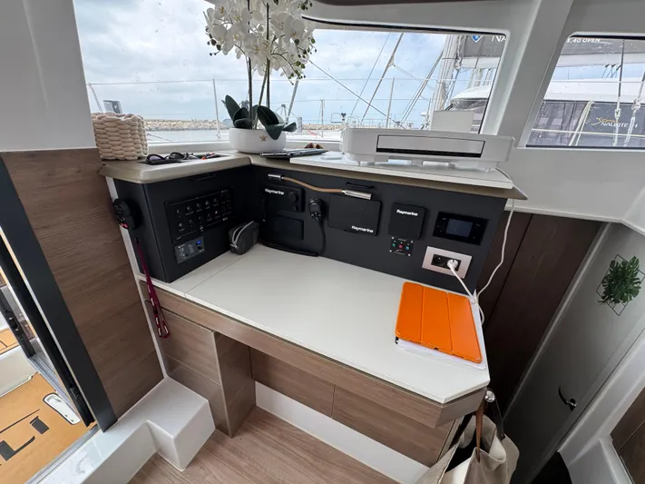  Yacht Photos Pics Modern navigation station on 2023 Bali 4.2 yacht with control panels and decor.