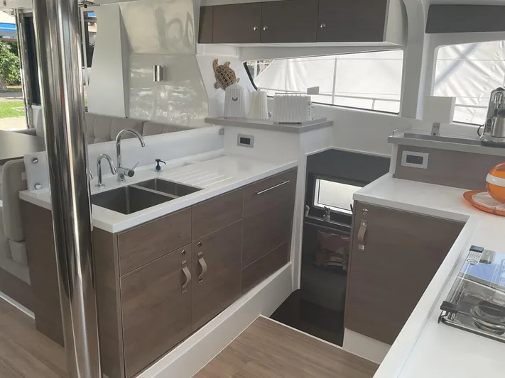  Yacht Photos Pics Modern kitchen interior of 2023 Bali 4.2 yacht with sleek cabinetry and dual sinks.