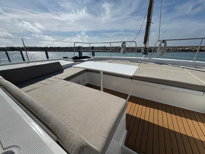  Yacht Photos Pics Luxurious Bali 4.2 yacht deck with comfortable seating, 2023 model, under a clear sky.