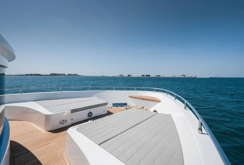  Yacht Photos Pics Luxury deck of 2024 Nomad 75 SUV yacht with ocean view.