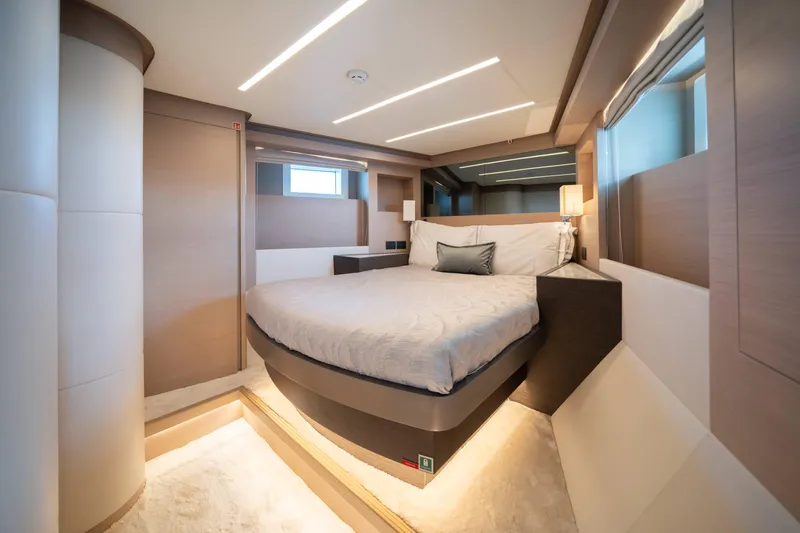  Yacht Photos Pics Luxurious bedroom interior of 2024 Nomad 75 SUV yacht with modern design and ambient lighting.
