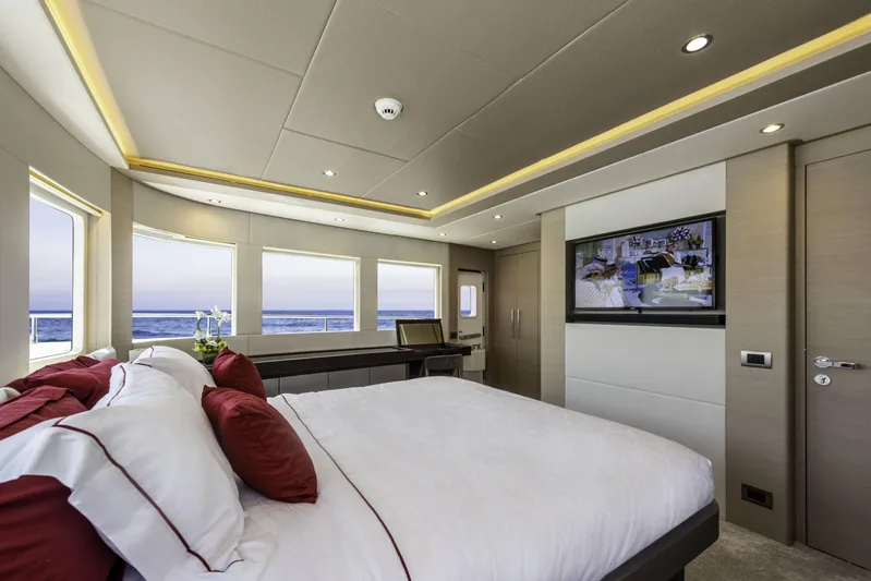  Yacht Photos Pics Luxurious bedroom interior of 2024 Nomad 75 SUV yacht with ocean view.