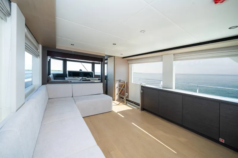  Yacht Photos Pics Luxurious interior of 2024 Nomad 75 SUV yacht with ocean view and modern seating.