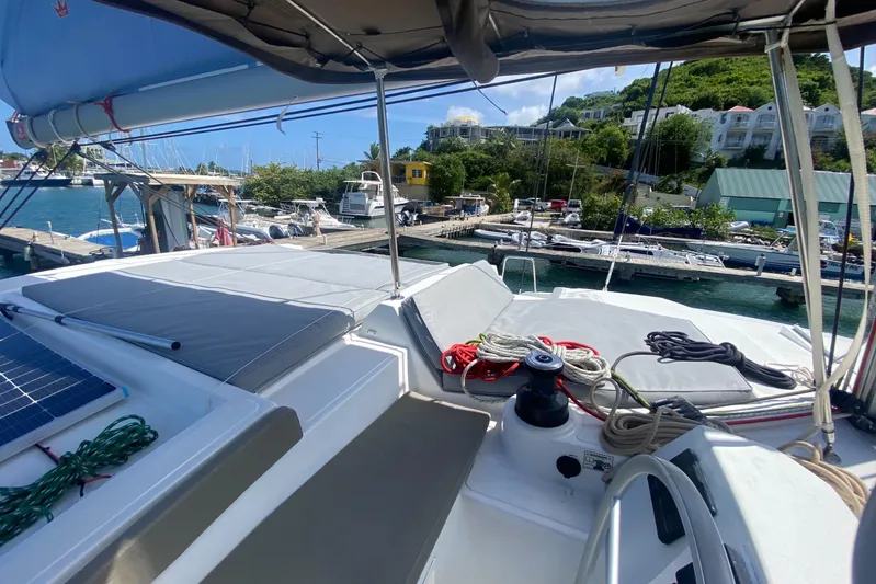 Mirabella Yacht Photos Pics 2022 Bali 4.2 yacht docked at marina, featuring deck and sailing equipment.