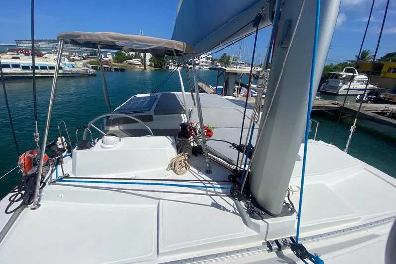 Mirabella Yacht Photos Pics Sailing yacht Bali 4.2, 2022 model, docked at marina with clear blue water.